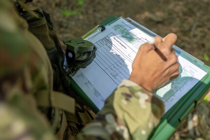 Capt. Bethani Glover-Greaves, 18th Finance Battalion Alpha Company commander, takes part in a land navigation exercise at the Mekong Delta day land navigation course on Fort Jackson, S.C., April 20, 2026. Twelve finance and comptroller Soldiers took part in the land navigation course on the first day of the U.S. Army Finance Corps’ annual Finance Soldier of the Year competition. (U.S. Army photo by Mark R. W. Orders-Woempner)