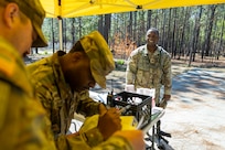 Capt. Terry Montgomery, 15th Finance Battalion finance officer, awaits his score after completing a land navigation exercise at the Mekong Delta day land navigation course on Fort Jackson, S.C., April 20, 2026. Twelve finance and comptroller Soldiers took part in the land navigation course on the first day of the U.S. Army Finance Corps’ annual Finance Soldier of the Year competition. (U.S. Army photo by Mark R. W. Orders-Woempner)