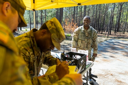 Capt. Terry Montgomery, 15th Finance Battalion finance officer, awaits his score after completing a land navigation exercise at the Mekong Delta day land navigation course on Fort Jackson, S.C., April 20, 2026. Twelve finance and comptroller Soldiers took part in the land navigation course on the first day of the U.S. Army Finance Corps’ annual Finance Soldier of the Year competition. (U.S. Army photo by Mark R. W. Orders-Woempner)