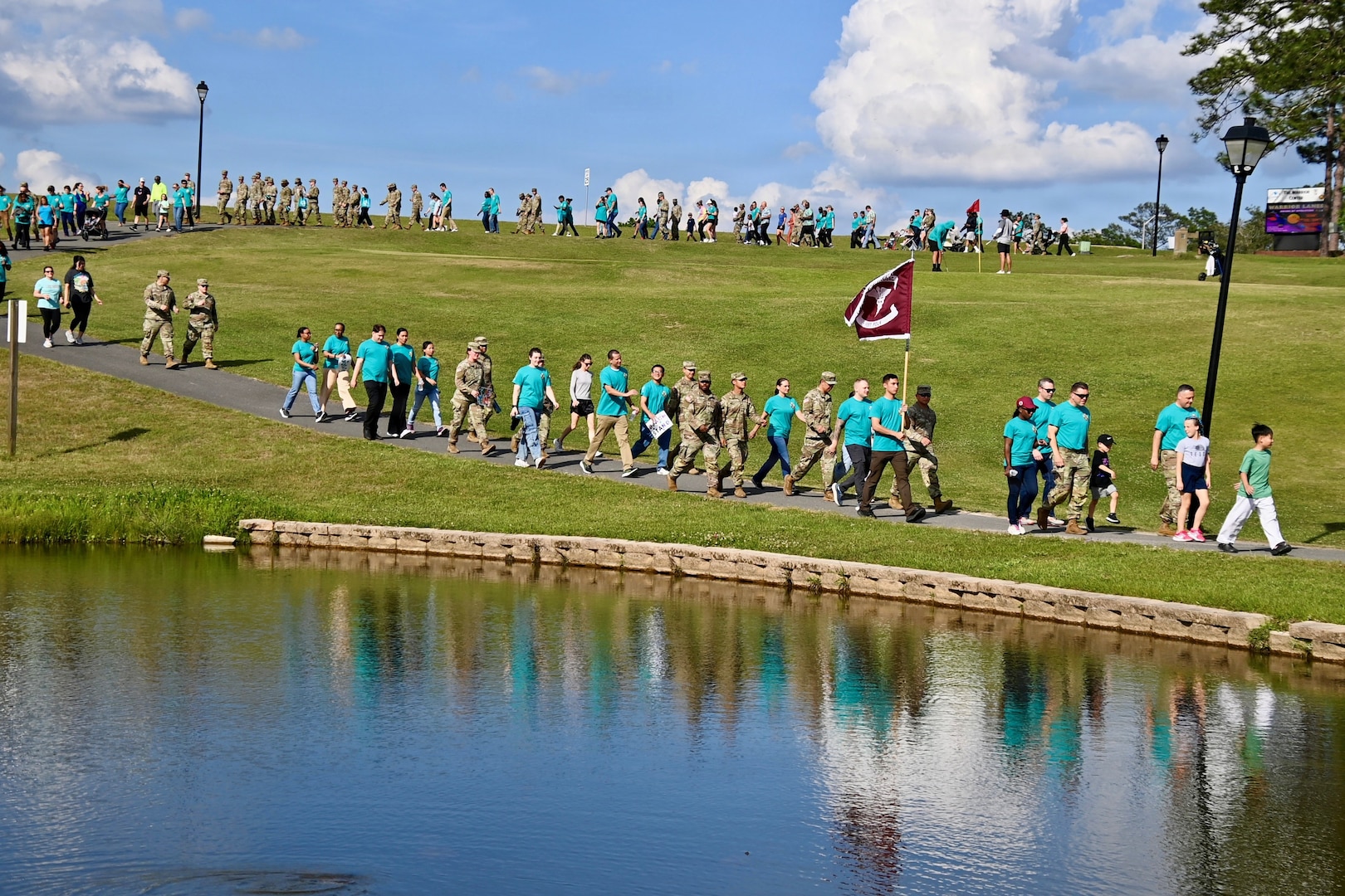 Bayne-Jones Army Community Hospital Employees take part in a community walk for sexual prevention and awareness.