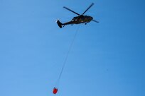 A UH-60 Black Hawk crew from Company G, 2-104th General Aviation Support Battalion, assists in fighting wildfires, April 23 – 25, 2026, near Broken Bow, Nebraska.