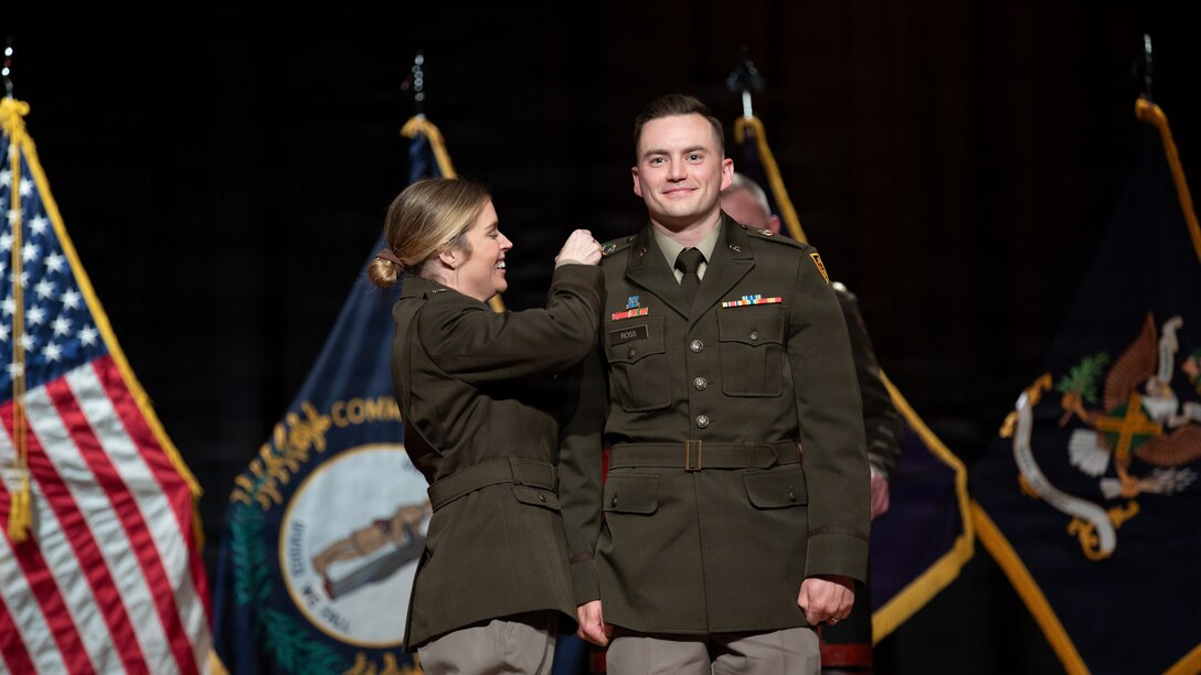 U.S. Army 2nd Lt. Ethan Ross is pinned by his wife during the Officer Candidate School Class 68-26 graduation ceremony at Kentucky State University’s David H. Bradford Hall Auditorium in Frankfort, Kentucky, April 18, 2026.