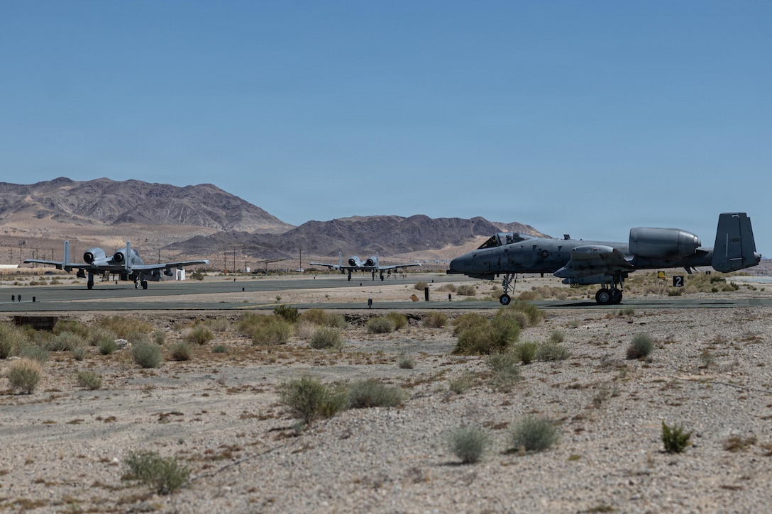 U.S. Air Force A-10 Thunderbolt II aircrafts assigned to 357th Fighter Squadron, Davis Monthan Air Force Base, prepare for takeoff during expeditionary landing field training, Marine Corps Air Ground Combat Center, Twentynine Palms, California, April 14, 2026. Expeditionary landing field training is a critical capstone event for new wingmen to test their ability to operate the A-10 in a simulated deployed environment, including takeoffs and landings on unimproved surfaces, alongside joint partner forces. (U.S. Marine Corps photo by Lance Cpl. Lainey Brummett)