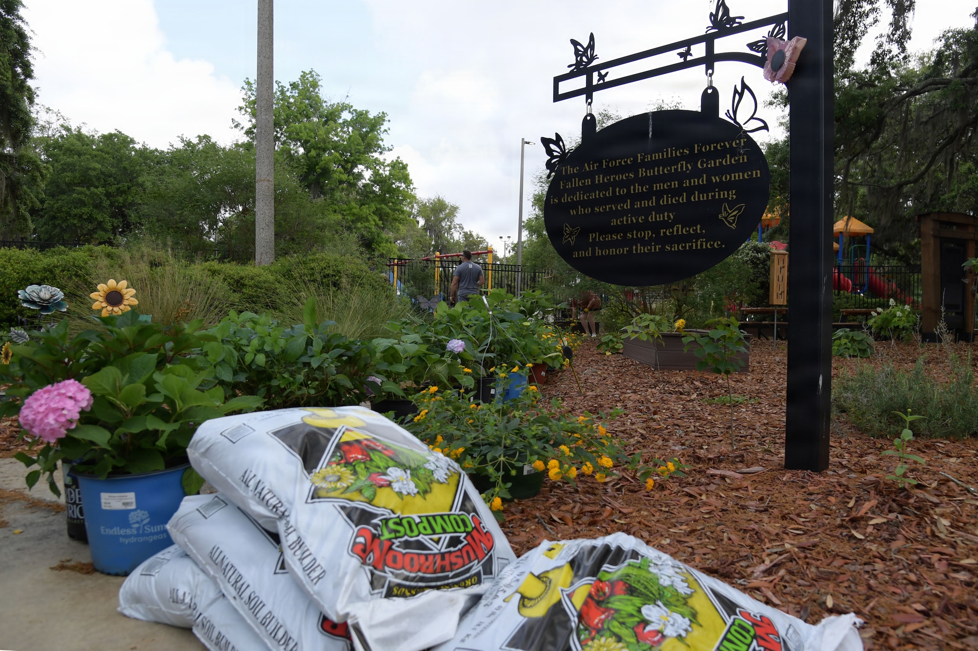 Landscaping supplies are on display outside.