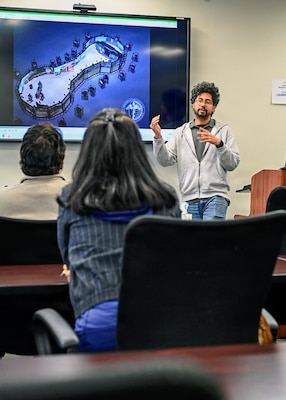 260409-N-IX644-1062 (April 9, 2026) SILVER SPRING, Md. Fernando Reyes, a 3-D artist working at the Val G. Hemming Simulation Center, gives a demonstration of the Wide Area Virtual Environment (WAVE), during the Inaugural Navy Medicine Education Leadership Summit in Silver Spring, Maryland. The summit aims to provide academic leaders with a unique, high-level overview of the strategic challenges and groundbreaking opportunities within Navy Medicine for future military healthcare professionals. The Navy Medicine Enterprise's 44,000+ talented and ready forces optimize health readiness, deliver quality healthcare, and provide global expeditionary medical support to warfighters. (U.S. Navy photo by Mass Communication Specialist 2nd Class Sasha Ambrose)