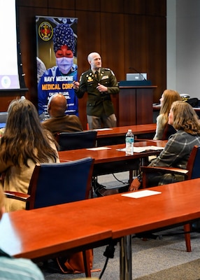 260409-N-IX644-1009 (April 9, 2026) BETHESDA, Md. U.S. Army Lt. Col. Michael Orestes, residency program director at Walter Reed National Military Medical Center (WRNMMC), presents a brief during the Inaugural Navy Medicine Education Leadership Summit at WRNMMC in Bethesda, Maryland. The summit aims to provide academic leaders with a unique, high-level overview of the strategic challenges and groundbreaking opportunities within Navy Medicine for future military healthcare professionals. The Navy Medicine Enterprise's 44,000+ talented and ready forces optimize health readiness, deliver quality healthcare, and provide global expeditionary medical support to warfighters. (U.S. Navy photo by Mass Communication Specialist 2nd Class Sasha Ambrose)