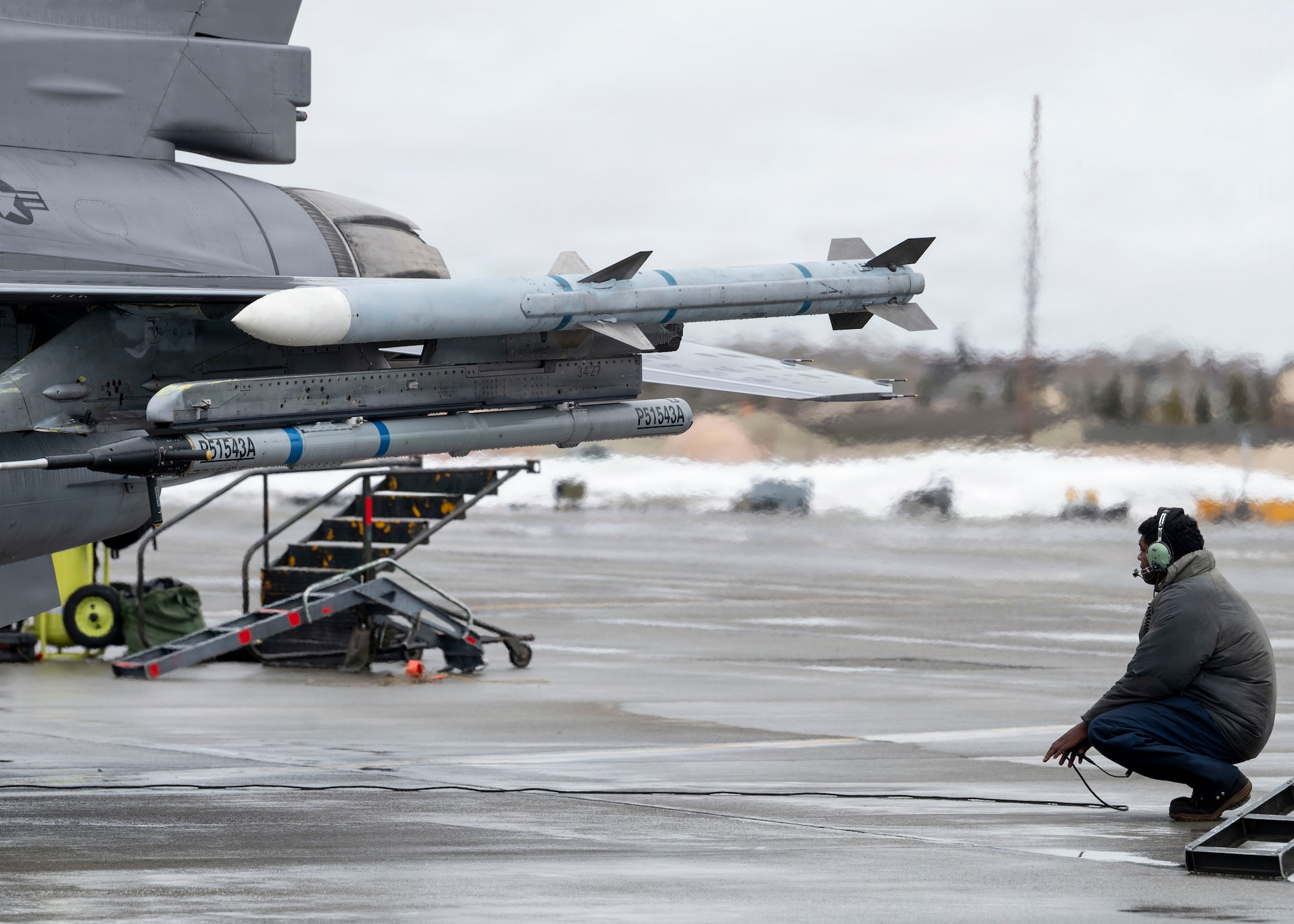 A U.S. Air Force maintainer observes an F-16 Fighting Falcon as part of preflight maintenance checks during RED FLAG-Alaska 26-1 at Eielson Air Force Base, Alaska, April 20, 2026.