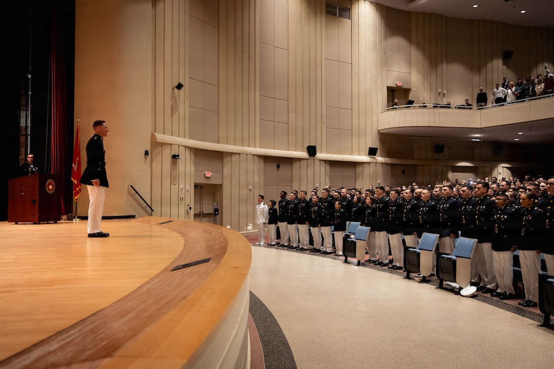 U.S. Marine Corps Maj. John Bayko, company commander, Company E, The Basic School, Training Command, dismisses the company during a graduation ceremony at Marine Corps Base Quantico, Virginia, March 13, 2026. TBS trains and educates newly commissioned or appointed officers in the high standards of professional knowledge, esprit de corps, and leadership to prepare them for duty as company-grade officers. (U.S. Marine Corps photo by Cpl. Joshua Barker)