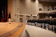 U.S. Marines and foreign military graduates with Basic Officer Course 5-25, Company E, The Basic School, Training Command, pose for a photo after a graduation ceremony at Marine Corps Base Quantico, Virginia, March 13, 2026. TBS trains and educates newly commissioned or appointed officers in the high standards of professional knowledge, esprit de corps, and leadership to prepare them for duty as company-grade officers. (U.S. Marine Corps photo by Cpl. Joshua Barker)