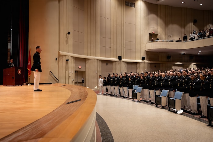 U.S. Marines and foreign military graduates with Basic Officer Course 5-25, Company E, The Basic School, Training Command, pose for a photo after a graduation ceremony at Marine Corps Base Quantico, Virginia, March 13, 2026. TBS trains and educates newly commissioned or appointed officers in the high standards of professional knowledge, esprit de corps, and leadership to prepare them for duty as company-grade officers. (U.S. Marine Corps photo by Cpl. Joshua Barker)
