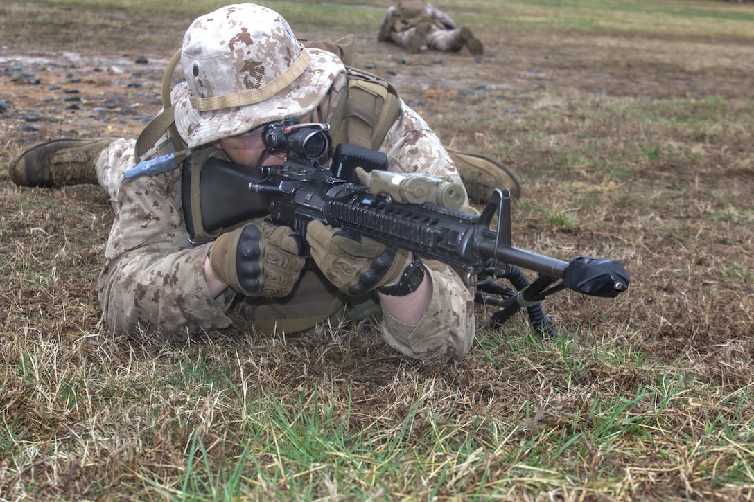U.S. Marine Corps students with Bravo Company, The Basic School, conduct preparatory actions for platoon level tactics at Marine Corps Base Quantico, Virginia, 16 March 2026. The purpose of the simulated platoon attacks was to introduce Marines to the fundamentals of the offensive and defensive tactics required for provisional rifle platoon commanders. (U.S. Marine Corps photo by Sgt. Myra Walker)