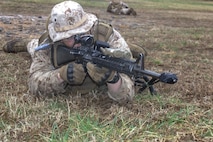 U.S. Marine Corps students with Bravo Company, The Basic School, conduct preparatory actions for platoon level tactics at Marine Corps Base Quantico, Virginia, 16 March 2026. The purpose of the simulated platoon attacks was to introduce Marines to the fundamentals of the offensive and defensive tactics required for provisional rifle platoon commanders. (U.S. Marine Corps photo by Sgt. Myra Walker)