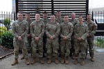 U.S. Soldiers with the Nebraska and North Dakota National Guards, assigned to Joint Task Force-District of Columbia in support of the D.C. Safe and Beautiful mission, pose for a group photo at a hotel in Alexandria, Virginia, April 28, 2026. About 2,500 National Guard members are supporting the mission, providing critical assistance to the Metropolitan Police Department to help ensure the safety of residents, commuters and visitors throughout the District. Photo by Staff Sgt. Thomas Norris.