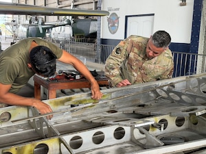 U.S. Air Force Tech. Sgt. Nestor Rivera, aircraft structural maintenance instructor, 156th Tactical Advisory Squadron, Puerto Rico Air National Guard, assesses corrosion damage on the wing of a Cessna 172 at Panama City, Panama, March 16, 2026. (U.S. Air National Guard courtesy photo)