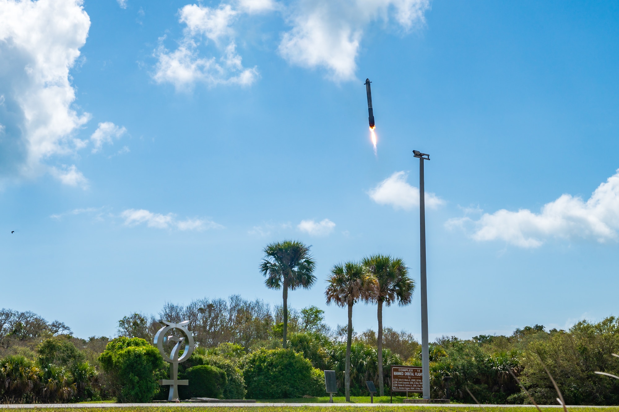 Space Launch Delta 45 and the Eastern Range, a critical component to today’s success, facilitated the Falcon Heavy launch today, April 29, 2026, as the latest success in a record-breaking month. Where Mercury Program vehicles flew once and fell into the ocean, modern reusable rockets now land and fly again. The Mercury 7 memorial at Cape Canaveral Space Force Station marks how far technology has come. This achievement directly advances SLD 45 efforts to expand partnerships and deliver unmatched space access for our nation. (U.S. Space Force photo by Gwendolyn Kurzen)