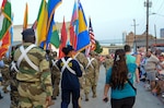 International Military Students and staff participate in the annual Fiesta Flambeau parade in San Antonio, Texas, April 25, 2026. Over 80 international students proudly represented their nations’ flags at the parade alongside DLIELC leadership and staff. Defense Language Institute English Language Center International Military Students and volunteers walked roughly three miles through the streets of downtown San Antonio as part of the Field Studies Program which helps strengthen English language skills and partnerships. (U.S. Air Force photo by Agnes Koterba)