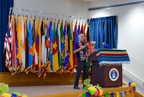 Lewis Vetter, President of the Conservation Society of San Antonio, speaks during the Fiesta Showcase at the Defense Language Institute English Language Center in San Antonio, Texas, April 15, 2026.  Vetter shared the organization’s role in preserving San Antonio’s history and supporting the community during the event. DLIELC is known as the “Gateway to America,” and builds security cooperation through English language training and cultural immersion for international military partners and pre-basic combat trainees in the U.S. Army and Coast Guard. (U.S. Air Force photo by Agnes Koterba)