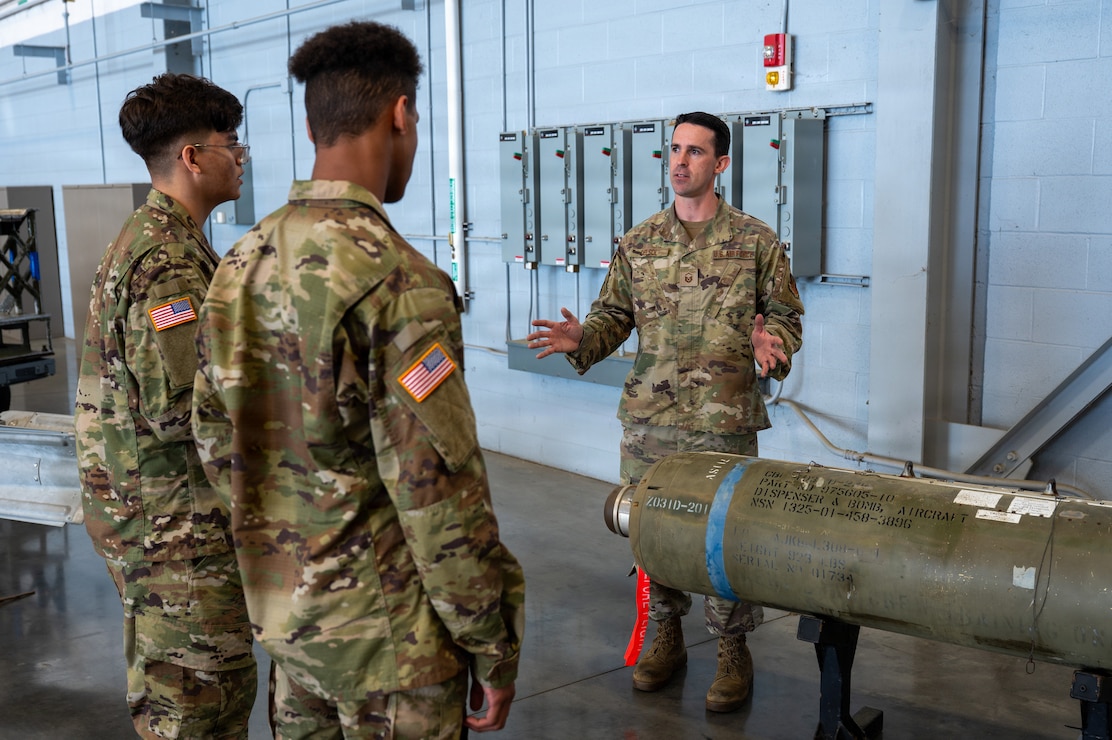 702nd MXS crew chief shows munitions to cadets