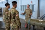 702nd MXS crew chief shows munitions to cadets