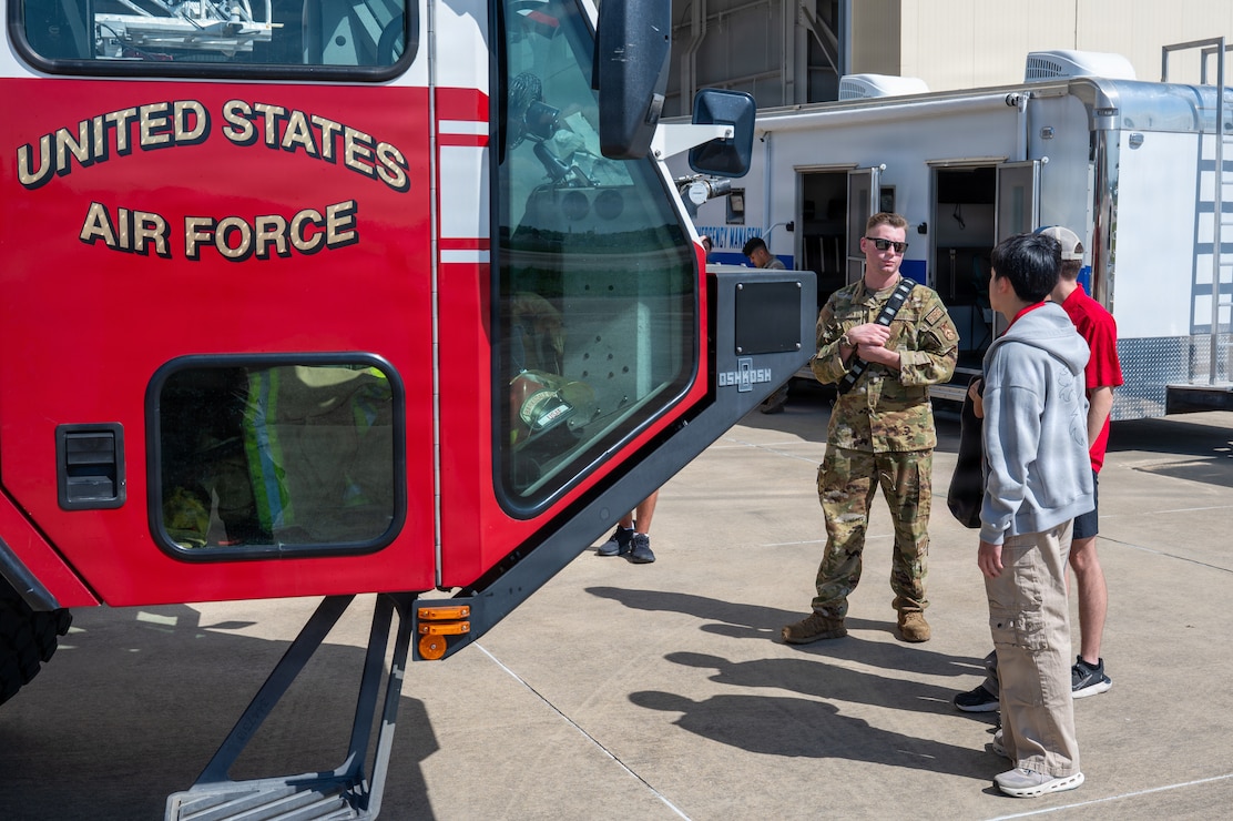 2nd CES firefighter gives cadets tour of firetruck