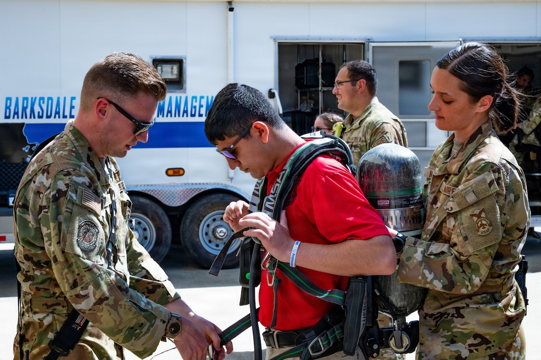 cadet tries on fire equipment