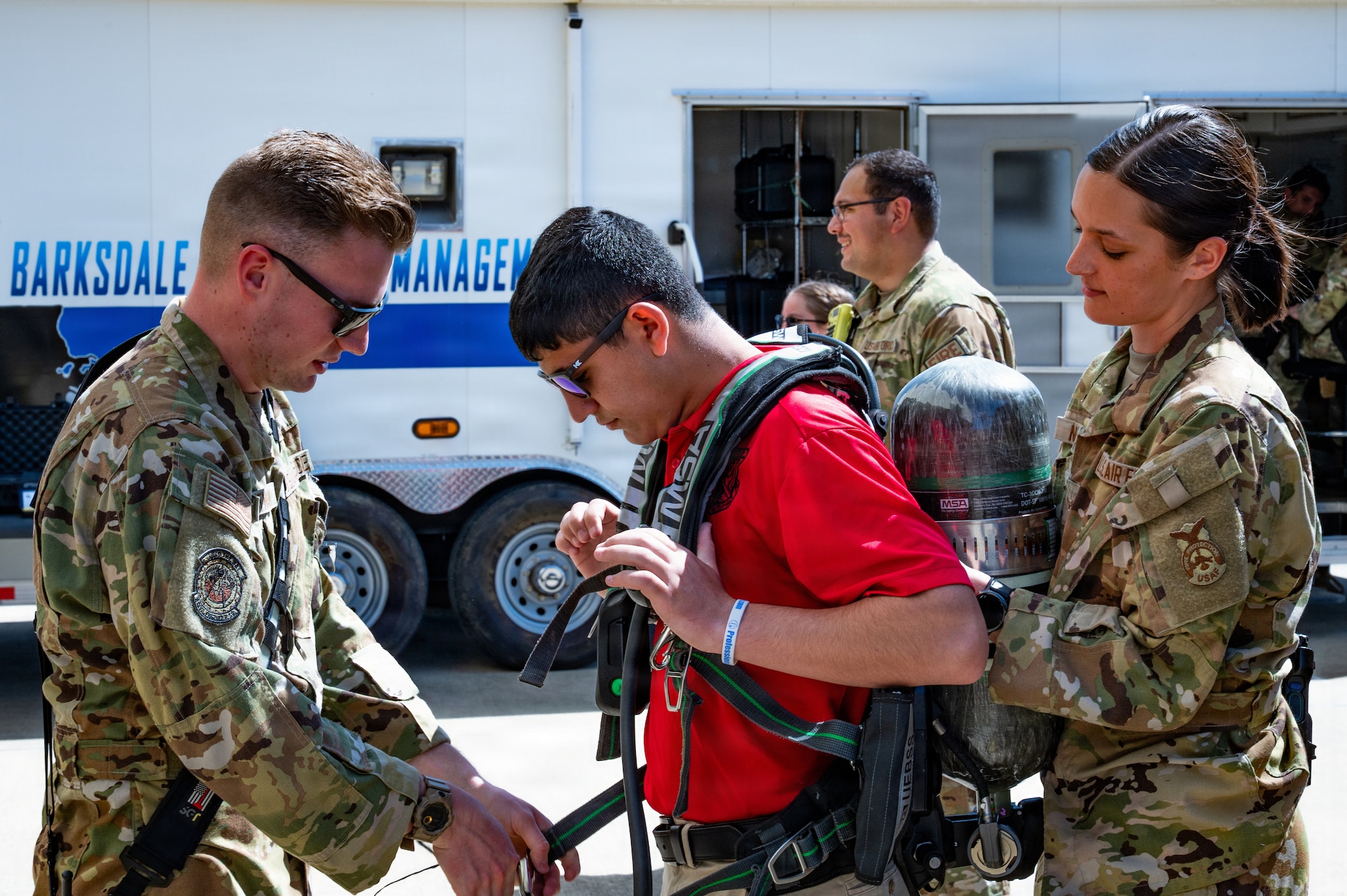 cadet tries on fire equipment