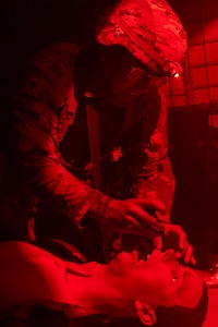 Spc. Erick Bedoya, 15th Finance Battalion financial management technician, provides tactical combat casualty care to a simulated casualty at the Medical Simulation Training Facility on Fort Jackson, S.C., April 21, 2026. Twelve finance and comptroller Soldiers were graded on their ability to provide medical care under fire as part of the U.S. Army Finance Corps’ annual Finance Soldier of the Year competition. (U.S. Army photo by Mark R. W. Orders-Woempner)