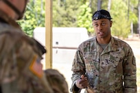 Staff Sgt. London Weathersby, 369th Adjutant General Battalion Bravo Company drill sergeant, provides instructions to a finance and comptroller Soldier at the Medical Simulation Training Facility on Fort Jackson, S.C., April 21, 2026. Twelve finance and comptroller Soldiers were graded on their ability to provide medical care under fire as part of the U.S. Army Finance Corps’ annual Finance Soldier of the Year competition. (U.S. Army photo by Mark R. W. Orders-Woempner)