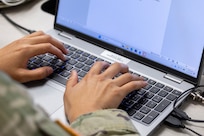 Sgt. Tina Martinez, 106th Finance Battalion Alpha Company training noncommissioned officer in charge, takes part in a two-hour essay writing exercise at Fort Jackson, S.C., April 21, 2026. Twelve finance and comptroller Soldiers wrote essays as part of the U.S. Army Finance Corps’ annual Finance Soldier of the Year competition. (U.S. Army photo by Mark R. W. Orders-Woempner)