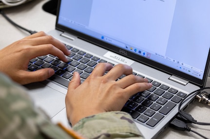Sgt. Tina Martinez, 106th Finance Battalion Alpha Company training noncommissioned officer in charge, takes part in a two-hour essay writing exercise at Fort Jackson, S.C., April 21, 2026. Twelve finance and comptroller Soldiers wrote essays as part of the U.S. Army Finance Corps’ annual Finance Soldier of the Year competition. (U.S. Army photo by Mark R. W. Orders-Woempner)
