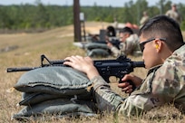 Pvt. 1st Class Zhiyi Wang, 18th Finance Battalion Bravo Company cashier, fires an M4 carbine at Fort Jackson, S.C., April 22, 2026. Twelve finance and comptroller Soldiers took their best shots as part of the U.S. Army Finance Corps’ annual Finance Soldier of the Year competition. (U.S. Army photo by Mark R. W. Orders-Woempner)