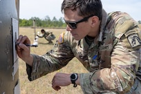 Staff Sgt. Brandon Comninos, 18th Finance Battalion financial management analyst,