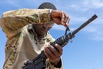 Capt. Terry Montgomery, 15th Finance Battalion finance officer, makes adjustments to his M4 carbine at Fort Jackson, S.C., April 22, 2026. Twelve finance and comptroller Soldiers took their best shots as part of the U.S. Army Finance Corps’ annual Finance Soldier of the Year competition. (U.S. Army photo by Mark R. W. Orders-Woempner)