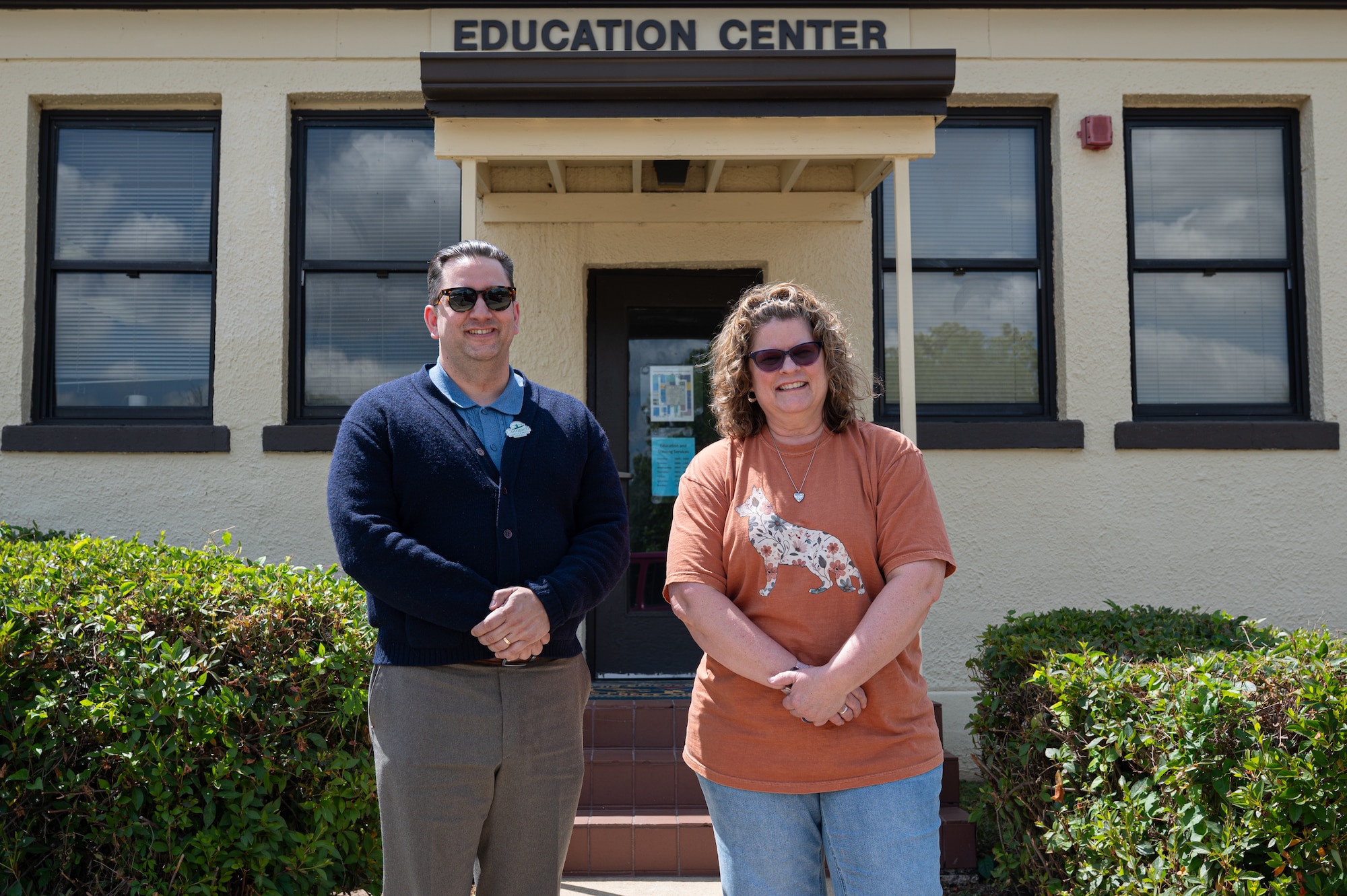 Thomas Baker, 42d Force Support Squadron education specialist, and Meghan Dunaway, 42d FSS testing administrator pose for a photo in front of the Education Office at Maxwell Air Force Base Alabama, April 29, 2026.