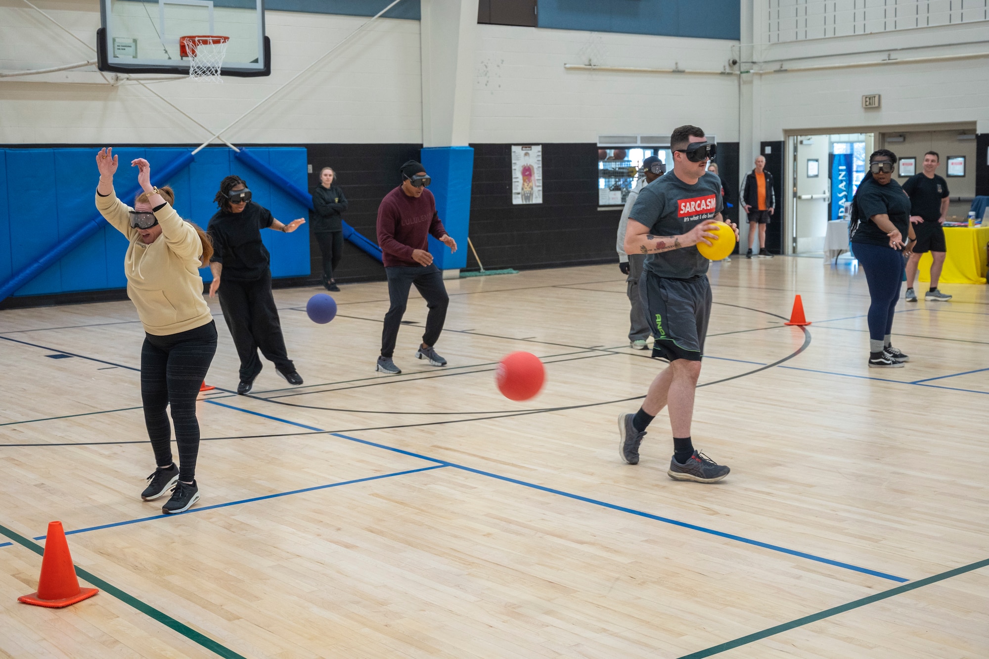 Joint Base Lewis-McChord community members and the 62d Airlift Wing Integrated Prevention and Resilience Office team play dodgeball during half time of the Directorate of Human Resources-Army Substance Abuse Program National Alcohol Awareness Month dodgeball tournament at JBLM, Washington, April 2, 2026.