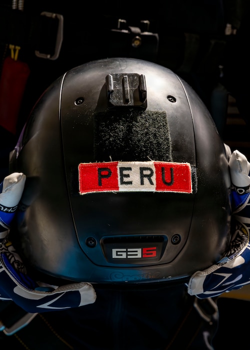 Pablo Lopez-Maheras, a U.S. Air Force Academy cadet and Wings of Blue member, holds his helmet in preparation for a demonstration during the Peru Airshow at Las Palmas Air Base, Peru, April 26, 2026. Lopez-Maheras, a first-generation American with family ties to Lima, Peru, grew up visiting the country and maintains close connections with relatives there. His participation represents his commitment to training and continued development in military service and aviation. (U.S. Air Force photo by Staff Sgt. Lauren Diaz)