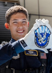 Pablo Lopez-Maheras, a U.S. Air Force Academy cadet and Wings of Blue member, prepares for a demonstration during the Peru Airshow at Las Palmas Air Base, Peru, April 26, 2026. Lopez-Maheras, a first-generation American with family ties to Lima, Peru, grew up visiting the country and maintains close connections with relatives there. His participation represents his commitment to training and continued development in military service and aviation. (U.S. Air Force photo by Staff Sgt. Lauren Diaz)