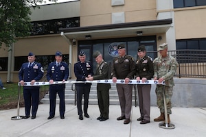 Gen. Stephen Whiting, commander of U.S. Space Command, and Lt. Gen. James Adams, director of the Defense Intelligence Agency, cut the ribbon during an official ribbon-cutting ceremony on Redstone Arsenal, Alabama, April 29, 2026. During the ceremony, Whiting announced the command’s operational control of the facility. “Today, we cut the ribbon on more than just a building,” Whiting said. “This facility represents a critical step forward for U.S. Space Command. This is where we plant our flag for the first operational element of our headquarters - the Joint Intelligence Support Element - here at Redstone Arsenal.” (Courtesy photo)