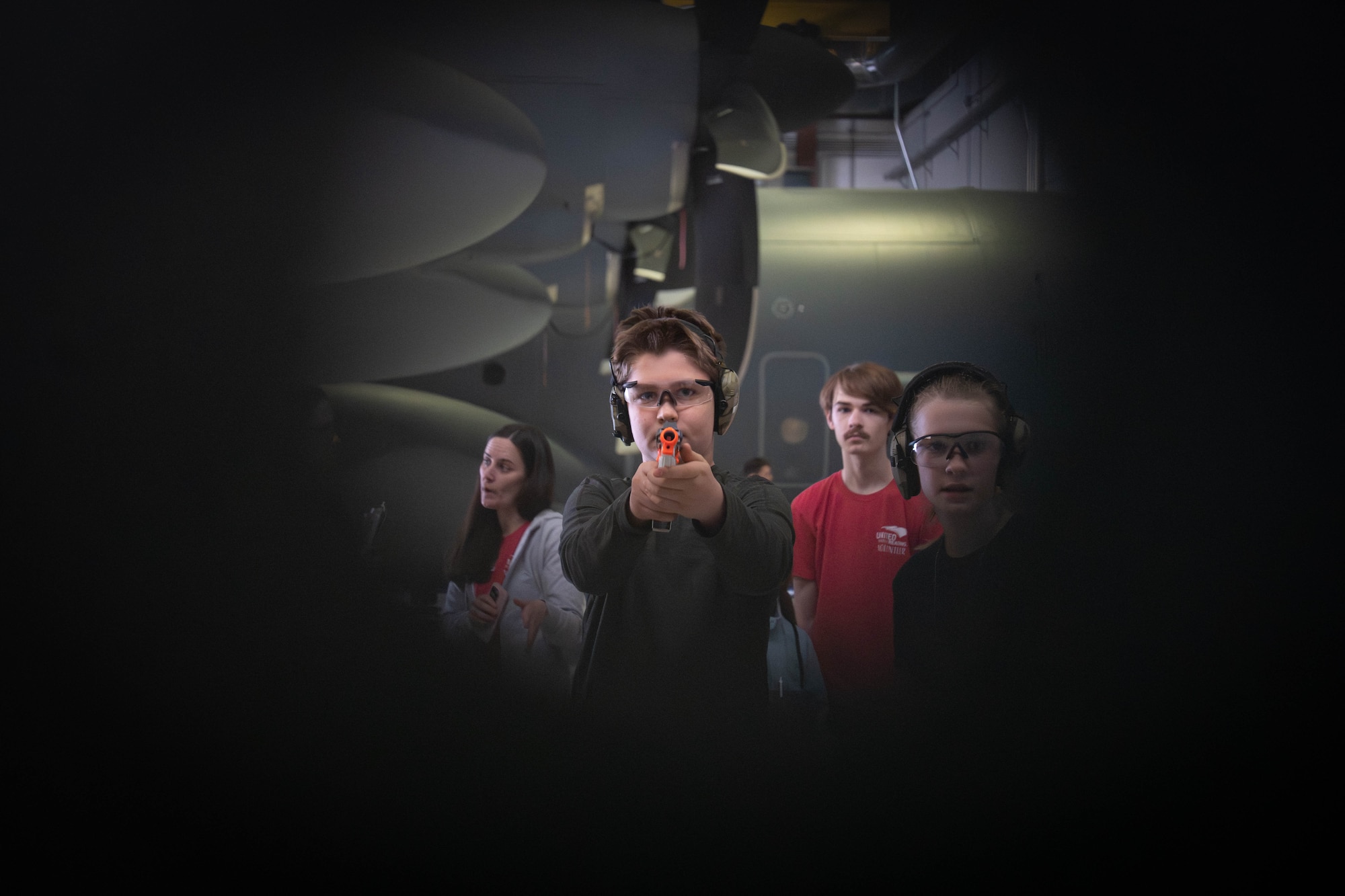 Children of military members on Joint Base Elmendorf-Richardson participate in a mock combat arms training test during a family deployment line on JBER, Alaska, April 25, 2026. The morale-boosting event allowed JBER families to explore pre-deployment processes such as a mock weapon qualification where Airmen are required to demonstrate weapon safety and operation. (U.S. Air Force photo by Airman 1st Class Keola Vischi)