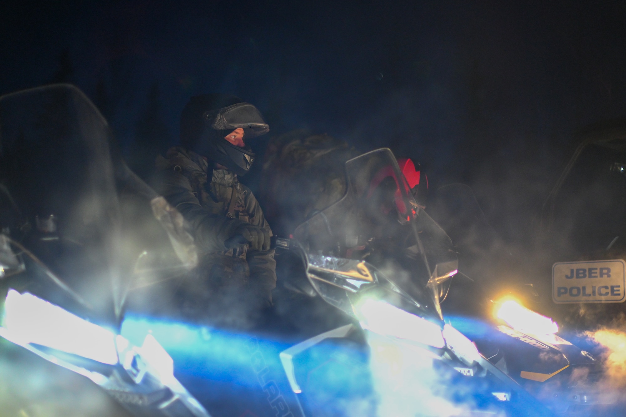 Airman 1st Class Ryan Smith, a 673d Security Forces Squadron defender, starts a snowmachine during the Arctic Combat Development Course (ACDC) on Joint Base Elmendorf-Richardson, March. 26, 2026. Comfortably operating a snowmachine in an austere environment is a major portion of the ACDC and requires no prior experience to attend the course. (U.S. Air Force photo by Airman 1st Class Eli A. Rose)