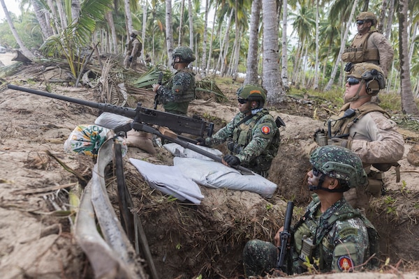 U.S. Marines assigned to 1st Battalion, 5th Marine Regiment, 1st Marine Division, Marine Rotational Force – Darwin, and Philippine marines stand by to engage during a counter-landing live-fire exercise as part of Exercise Balikatan 2026 in Aporawan, Philippines, April 27, 2026.