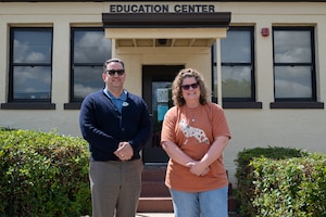 Thomas Baker, 42d Force Support Squadron education specialist, and Meghan Dunaway, 42d FSS testing administrator pose for a photo in front of the Education Office at Maxwell Air Force Base Alabama, April 29, 2026.