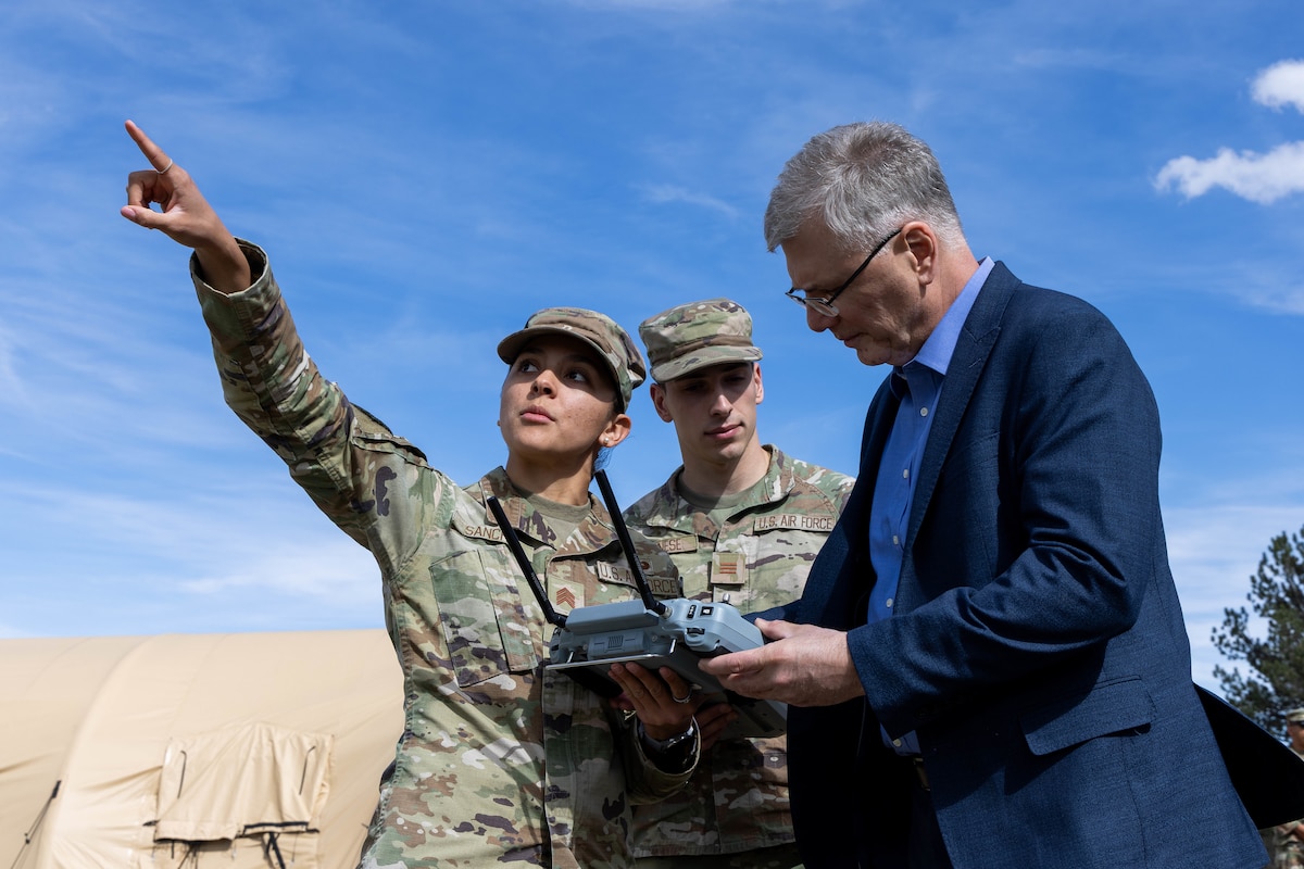 Two Cadets demonstrate drone operation procedures for the Secretary of the Air Force.