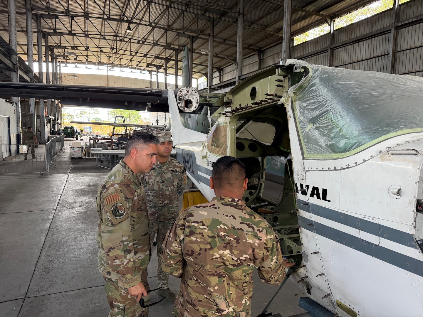 U.S. Air Force Tech. Sgt. Nestor Rivera, aircraft structural maintenance instructor, 156th Tactical Advisory Squadron, Puerto Rico Air National Guard, advises Aeronaval personnel on corrosion removal methods and rivet installation at Panama City, Panama, March 16, 2026. (U.S. Air National Guard courtesy photo)