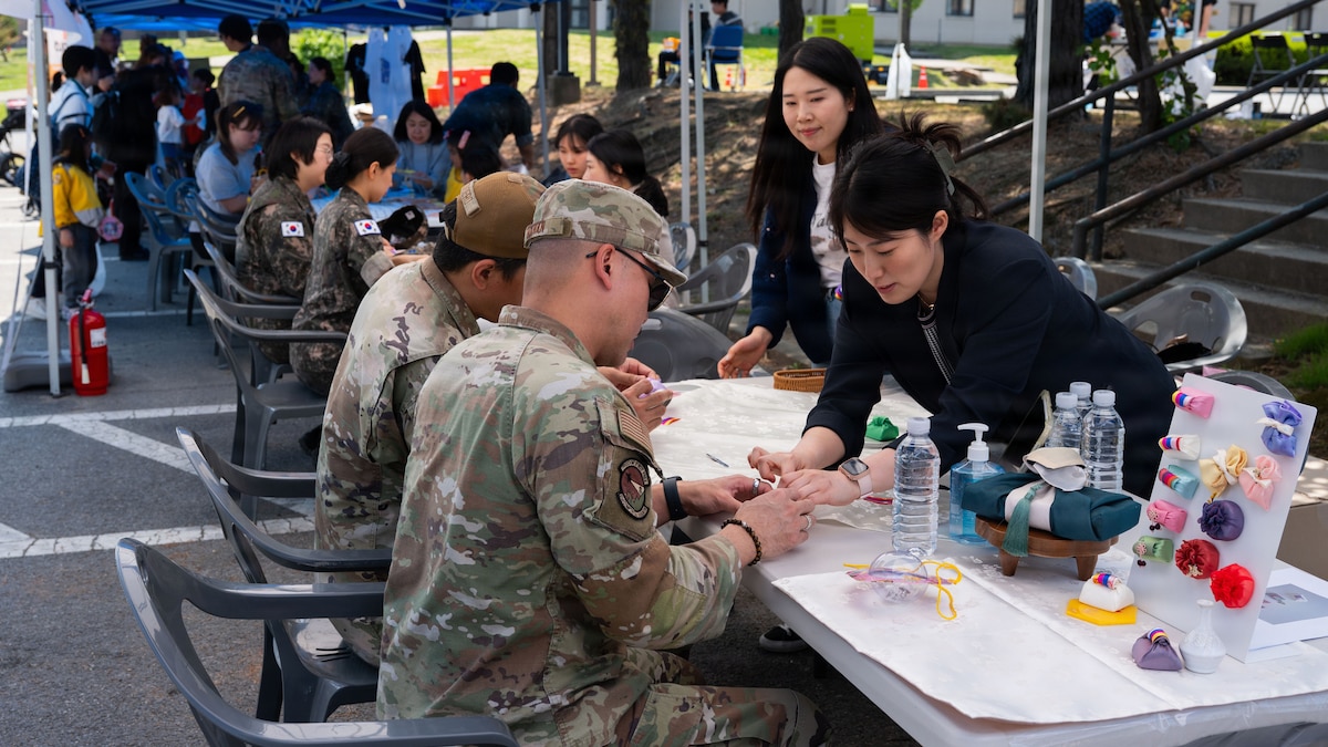 U.S. Airmen assigned to the 51st Fighter Wing participate in the K-Culture Day event at Osan Air Base, Republic of Korea, April 30, 2026. K-Culture Day highlighted the strength of the U.S.–ROK alliance by fostering cultural exchange and mutual understanding across the Osan community. (U.S. Air Force photo by Senior Airman Rome Bowermaster)