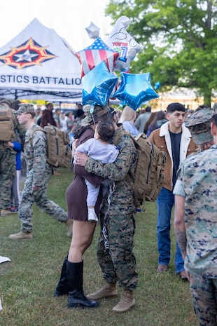 U.S. Marine Corps Cpl. David Andrade, a logistics specialist with Combat Logistics Battalion 6, Combat Logistics Regiment 2, 2nd Marine Logistics Group, embraces his family during a deployment homecoming event at Marine Corps Base Camp Lejeune, North Carolina, April 21, 2026. During the six-month deployment, CLB-6 supported two multi-national exercises in two different countries to strengthen regional security and Allied and partner integration as part of Marine Rotational Force-Europe. Andrade is a native of California. (U.S. Marine Corps photo by Sgt. Rafael Brambila-Pelayo)