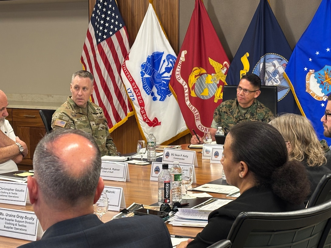 Sergeant Major of the Marine Corps Carlos Ruiz examines a nearly completed Presidential flag during a visit to Defense Logistics Agency Troop Support in Philadelphia on April 27. His visit included a tour of the flag room.