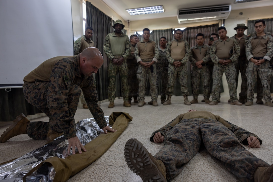 A U.S. Sailor with Combat Logistics Battalion 26, 22nd Marine Expeditionary Unit (Special Operations Capable), prepares an emergency blanket during a combat lifesaving course as part of a bilateral exercise on Naval Base Jaramijó, Ecuador, April 23, 2026. The 22nd MEU (SOC)’s Ecuador bilateral training enhances interoperability with partner forces, reinforces longstanding security relationships, and improves combined readiness to respond to crises across the region. U.S. military forces are deployed to the region in support of U.S. Southern Command mission objectives and the president’s priorities to strengthen regional security, disrupt illicit drug trafficking, and protect the U.S. homeland. (U.S. Marine Corps photo)