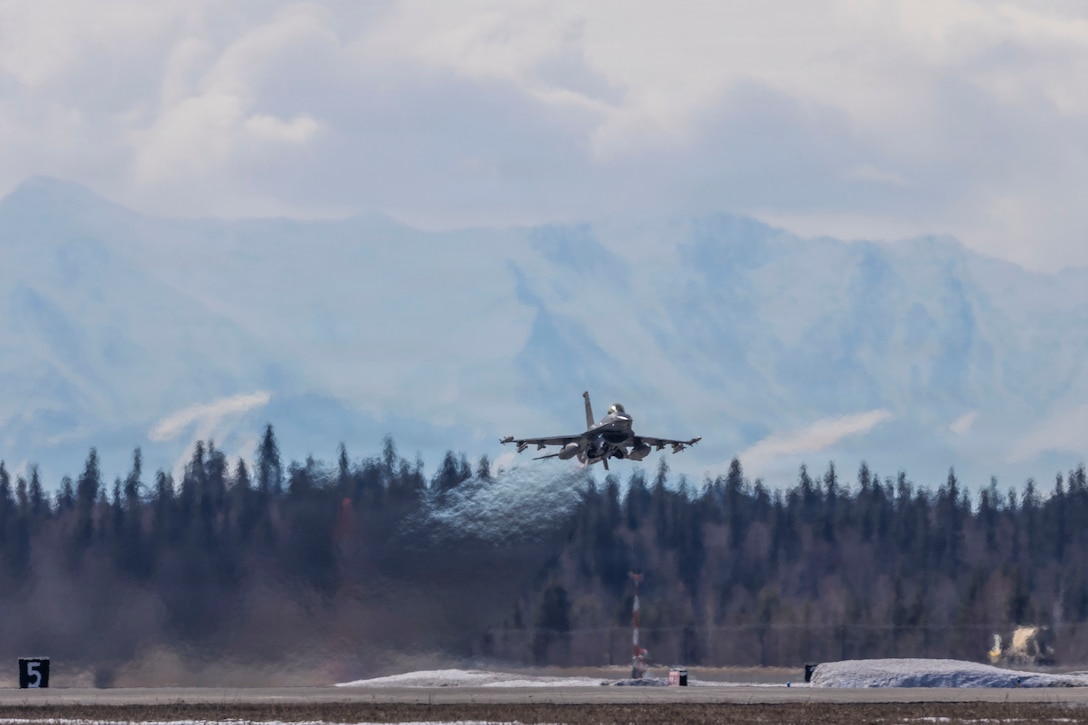 A U.S. Air Force F-16 Fighting Falcon with the 36th Fighter Squadron takes off during exercise Red Flag-Alaska 26-1 at Eielson Air Force Base, Alaska, April 27, 2026. Red Flag-Alaska is an exercise designed to simulate complex scenarios in a realistic training environment, providing unique opportunities to integrate joint and coalition forces into multilateral training, enhancing our ability to respond to contingencies in the region. (U.S. Marine Corps photo by Lance Cpl. Bryan Giraldo)