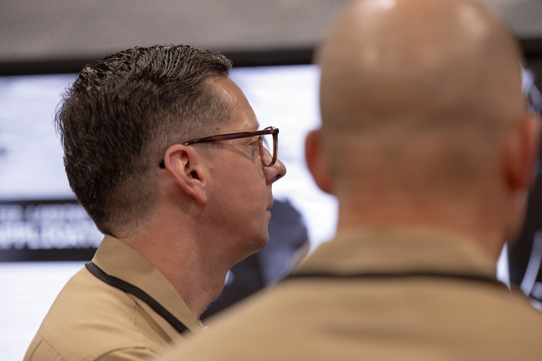 U.S. Marine Corps Lt. Col. Chase Johnson, Marine Innovation Unit Det A Lead, discusses on how the Marine Innovation Unit, serves as an on-demand supporting entity charged with accelerating the development and deployment of advanced capabilities, transforming the Naval Services’ capacity for technology and employment, and recruiting and retaining top reserve talent, during Modern Day Marine 2026, Walter E. Washington Convention Center, Washington, DC, April 29, 2026. Modern Day Marine brings together representatives from military, industry and government to collaborate in shaping the future of the United States Marine Corps. Through the interactions taking place at Modern Day Marine, the Corps is able to engage, educate and increase understanding of the Marine Corps' contributions to the National Defense Strategy. (U.S. Marine Corps photo by Cpl. Carlina Holland)